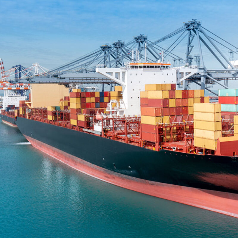 Crane,Loading,Cargo,Container,From,Truck,To,Container,Ship,In